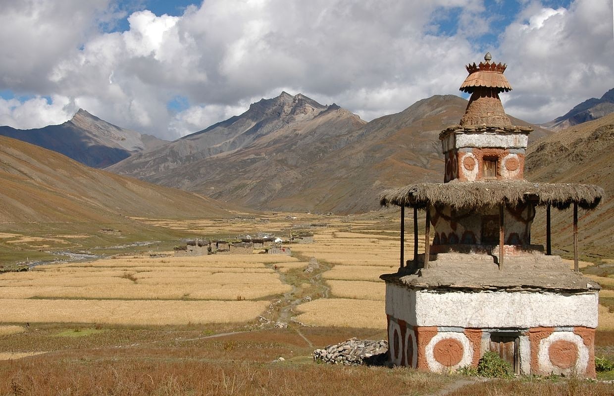 Chorten with barley fields; Tarap Valley in the southern part of Dolpa